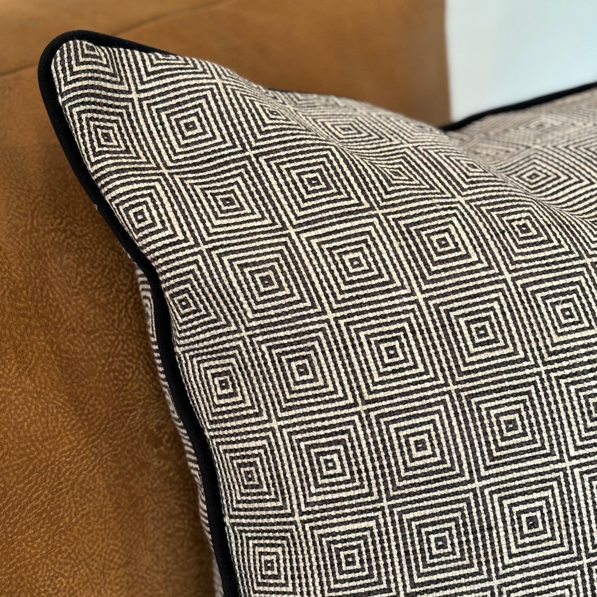 Black and White Geometric Patterned Cushion with Black Piping